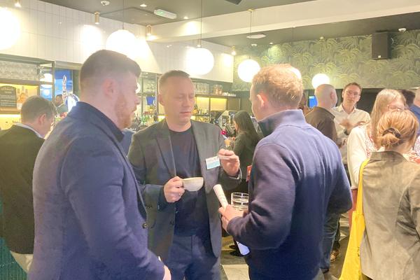 Professionals networking over espresso